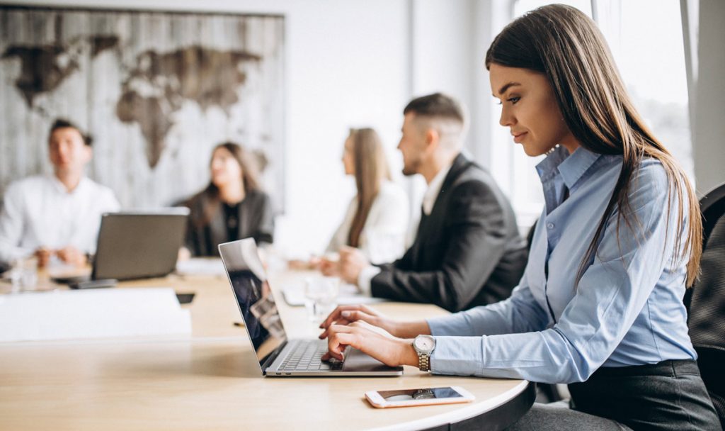 Group of people working out business plan in an office.